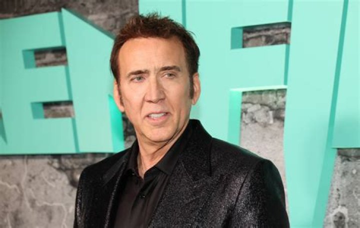 EXCLUSIVE: Nicolas Cage was spotted overdressed grocery shopping Saturday in Las Vegas, wearing a long sleeve white dress shirt with a black coat and sporting his new bright red hair. Hopefully, "The Leaving Las Vegas" star won't be leaving Vegas anytime soon. 20 Aug 2022 Pictured: Nicolas Cage with new red hair. Photo credit: TripleT / MEGA TheMegaAgency.com +1 888 505 6342 (Mega Agency TagID: MEGA888194_001.jpg) [Photo via Mega Agency]