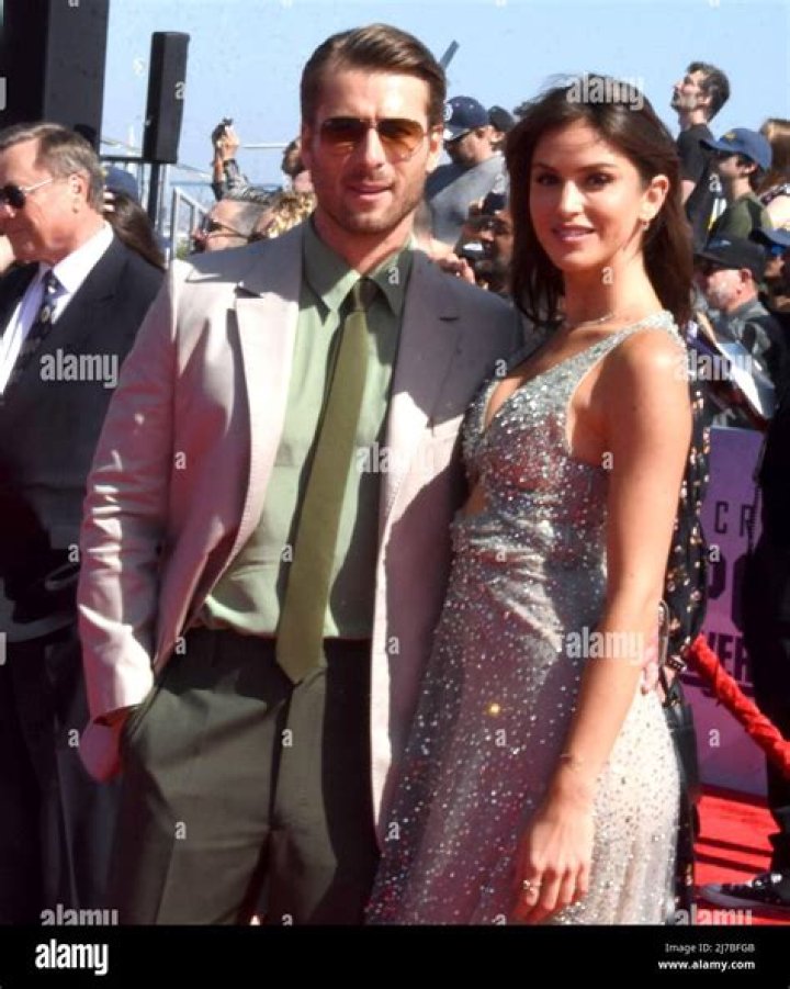Glen Powell and model Gigi Paris at the premiere of Devotion at the Regency Village Theatre in Los Angeles, California, USA, 15 November 2022. The movie will be released in theaters on 23 November 2022. Premiere of Devotion, Los Angeles, USA - 15 Nov 2022