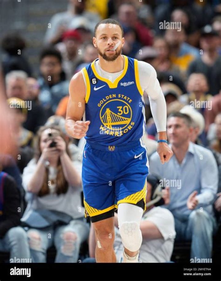 Golden State Warriors guard Stephen Curry hugs his daughter Riley after Game 5 of basketball's NBA Finals between the Warriors and the Cleveland Cavaliers in Oakland, Calif., Monday, June 12, 2017. The Warriors won 129-120 to win the NBA championship. (AP Photo/Marcio Jose Sanchez)
