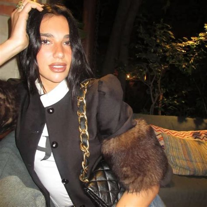 Singer Dua Lipa wears an orange bikini as she hits the beach after a sold out concert in Miami. 10 Feb 2022 Pictured: Dua Lipa. Photo credit: MEGA TheMegaAgency.com +1 888 505 6342 (Mega Agency TagID: MEGA827166_001.jpg) [Photo via Mega Agency]